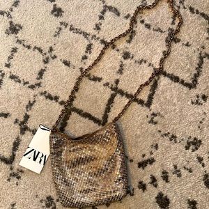 Crossbody purse with chain strap. Brand New, unused.